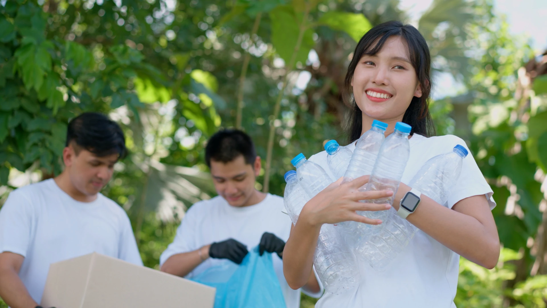 happy young asian students diverse volunteers with garbage bags cleaning area park concept environmental conservation world environment day recycling charity sustainability